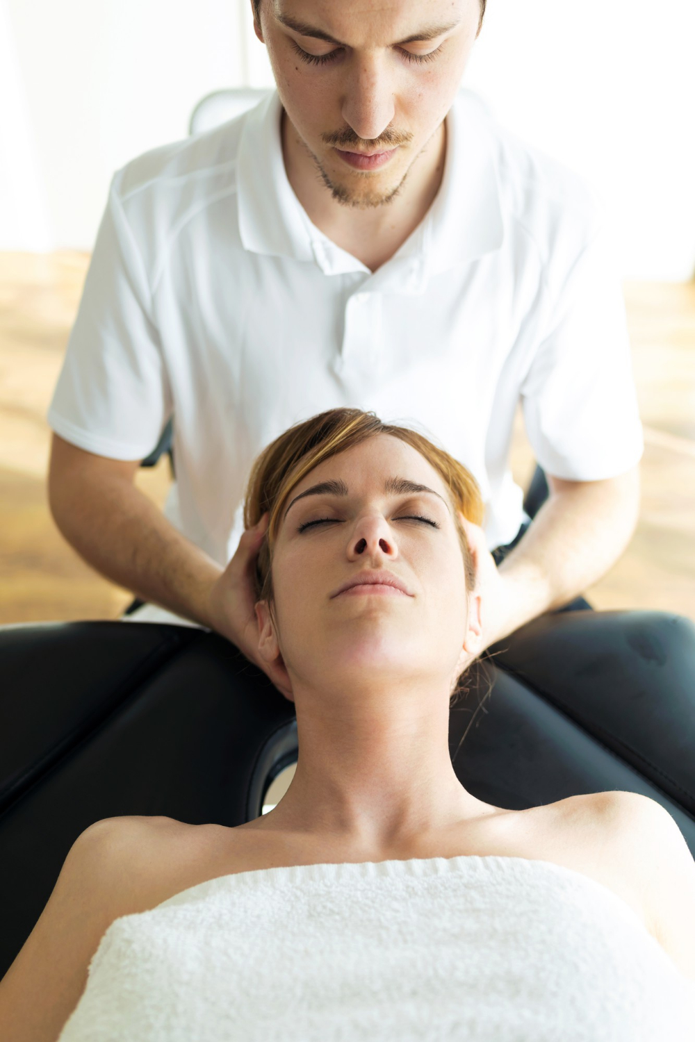shot-young-physiotherapist-doing-neck-treatment-patient-physiotherapy-room-rehabilitation-medical-massage-manual-therapy-concept